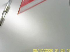 Blonde bimbo trying on to dress in dress room