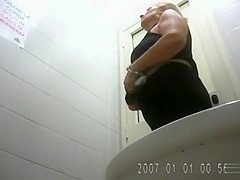 Blonde mature with a big ass goes pee