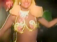 Carnival chicks in skimpy outfits dance