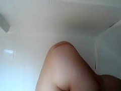 Chubby woman cleans bathtub naked