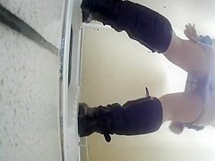 Chubby woman pissing in toilet