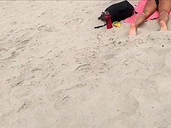 Fit blonde exercises on beach