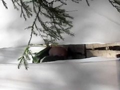 Funny catch of a girl wiping with leaves