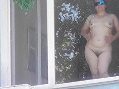 Hairy mature flashing in window