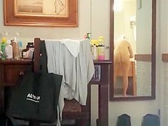 Husband films wife in bathroom