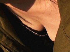 Japanese dark haired downblouse wearing a revealing black dress