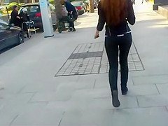 Long hair redhead in tight black sports pants