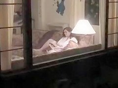 Peeping on a neighbor with a dildo