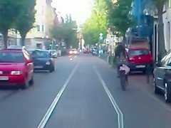 Red thong woman riding bike