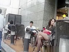 Sexy legs brunette in short skirt