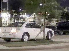 Skinny exhibitionist undresses in a fast food parking lot