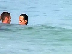 Swinging nudists spied on a beach