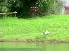 The older woman took a bath in the river