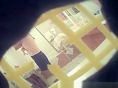 Mature changing her clothes for bed