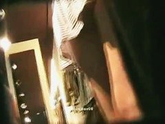 Slender Asian cutie invites an upskirt view of her butt