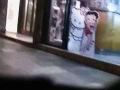 Slender brunette lets a watches her skirt